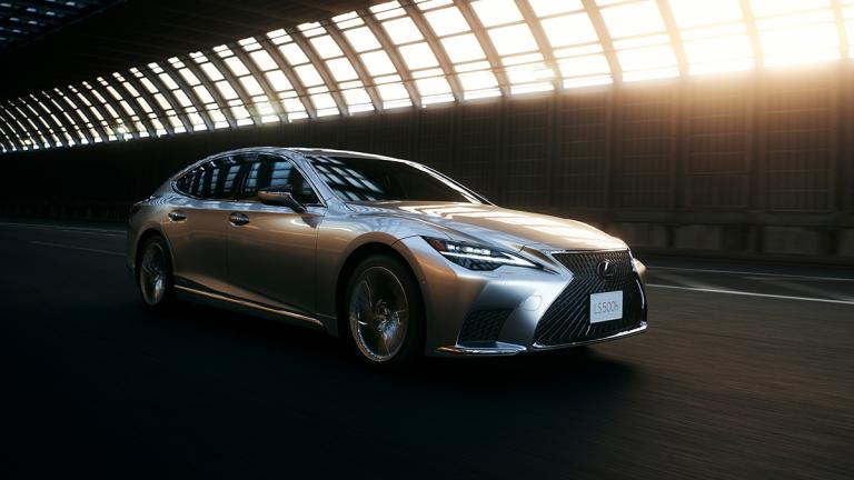 2024 Lexus LS 500h driving on the road.